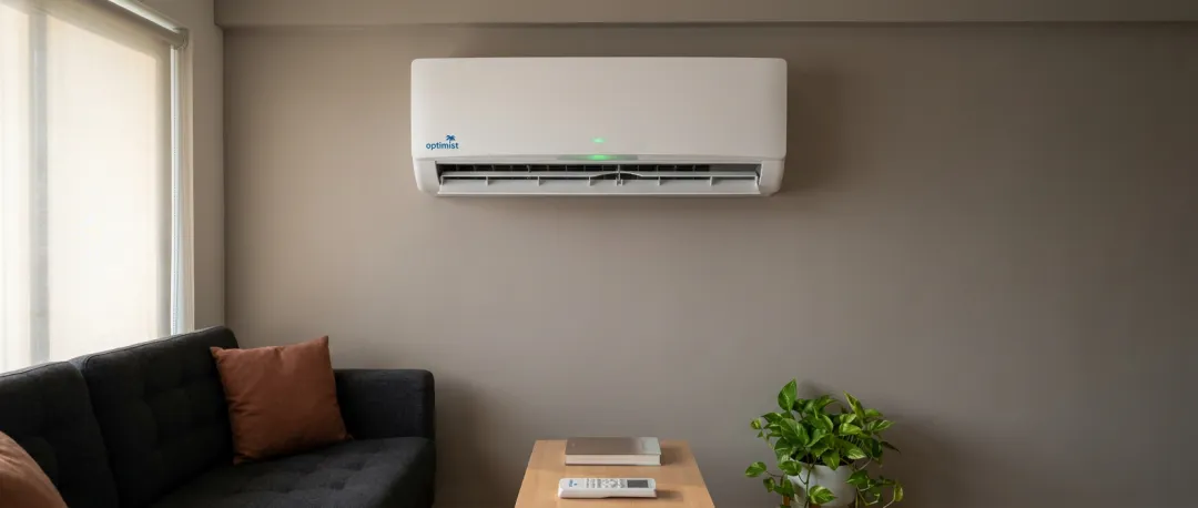 Small living room with split AC in Indian apartment