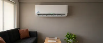 Small living room with split AC in Indian apartment
