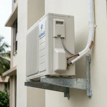 Split AC outdoor unit in a coastal city setting