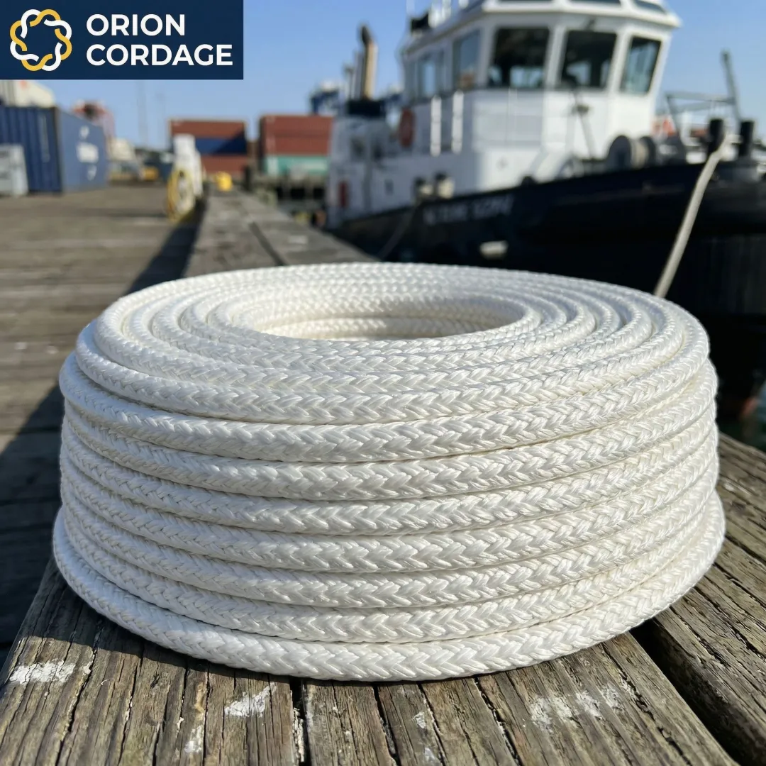 High-performance HMPE Dyneema rope coiled on industrial dock with marine vessel in background
