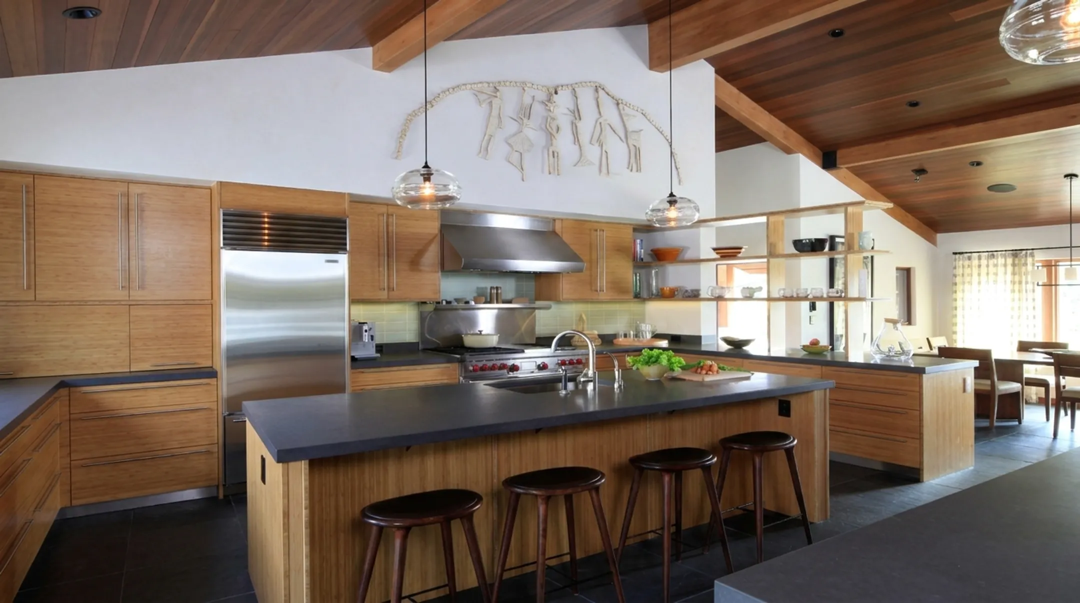 Furniture-like millwork with concealed appliances and built-in coffee station