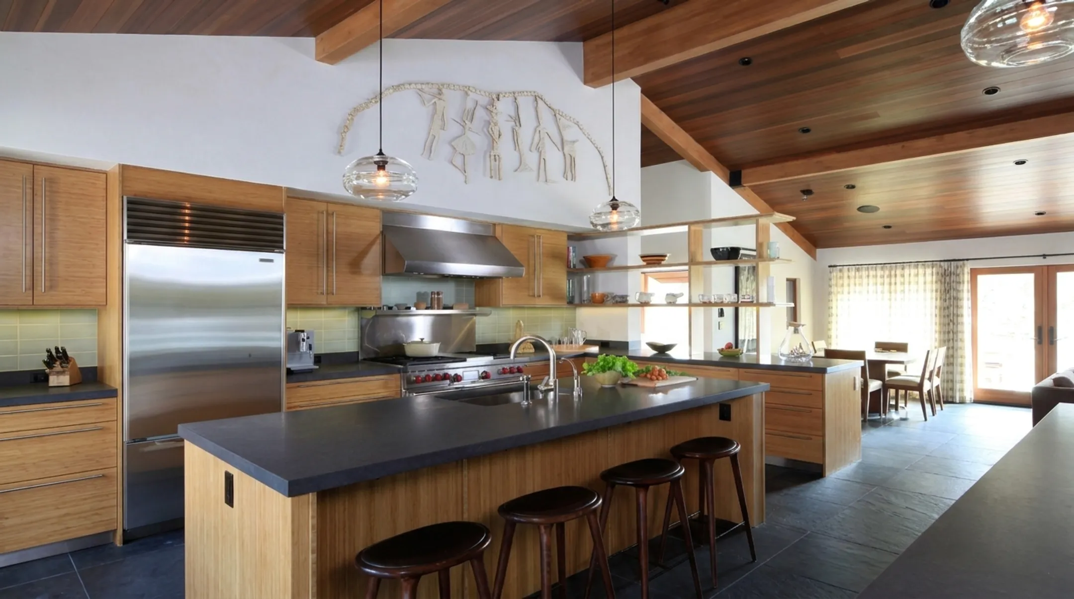 Crestmoore Place kitchen with black countertops and stainless appliance column