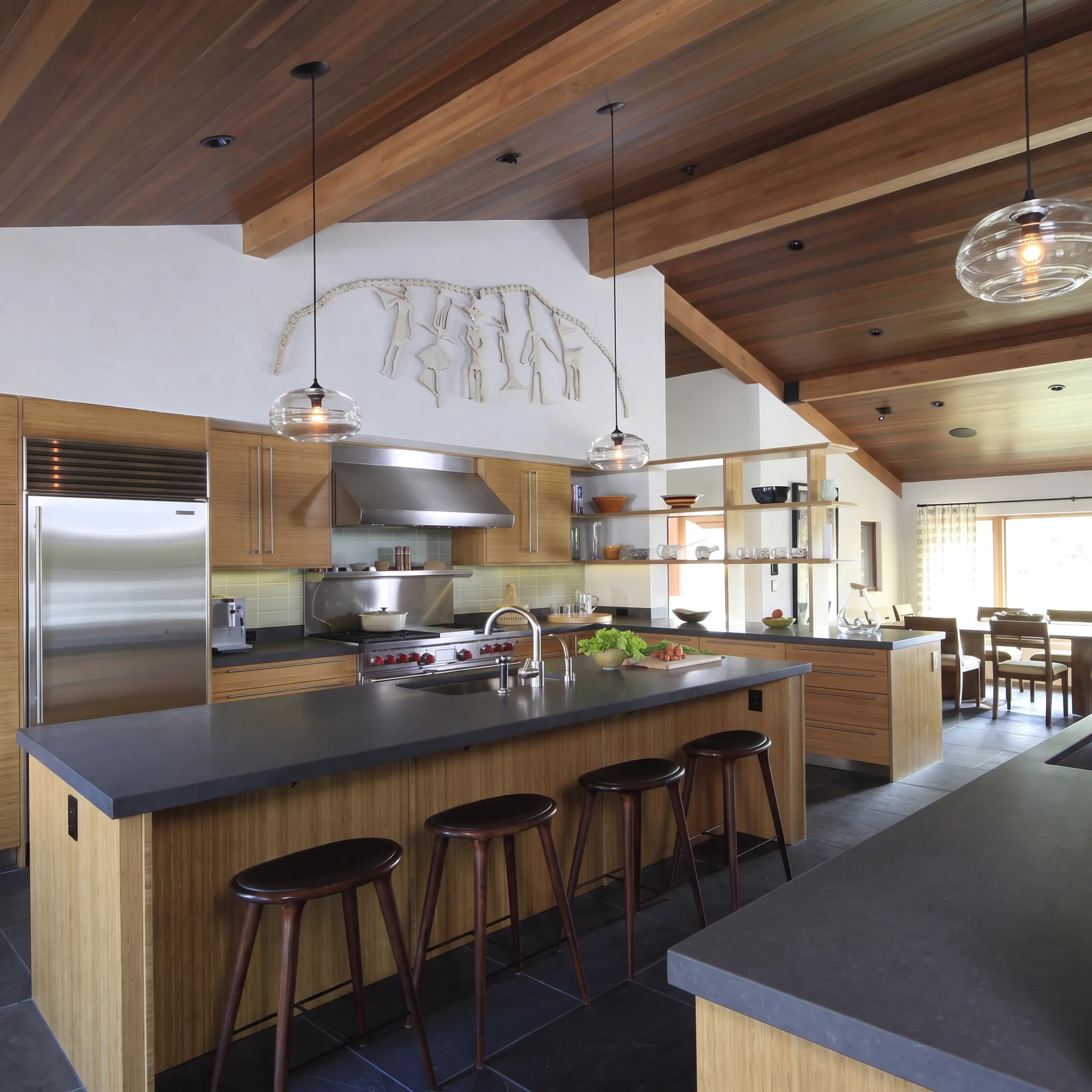 Architect reviewing a custom kitchen design with cabinetry details
