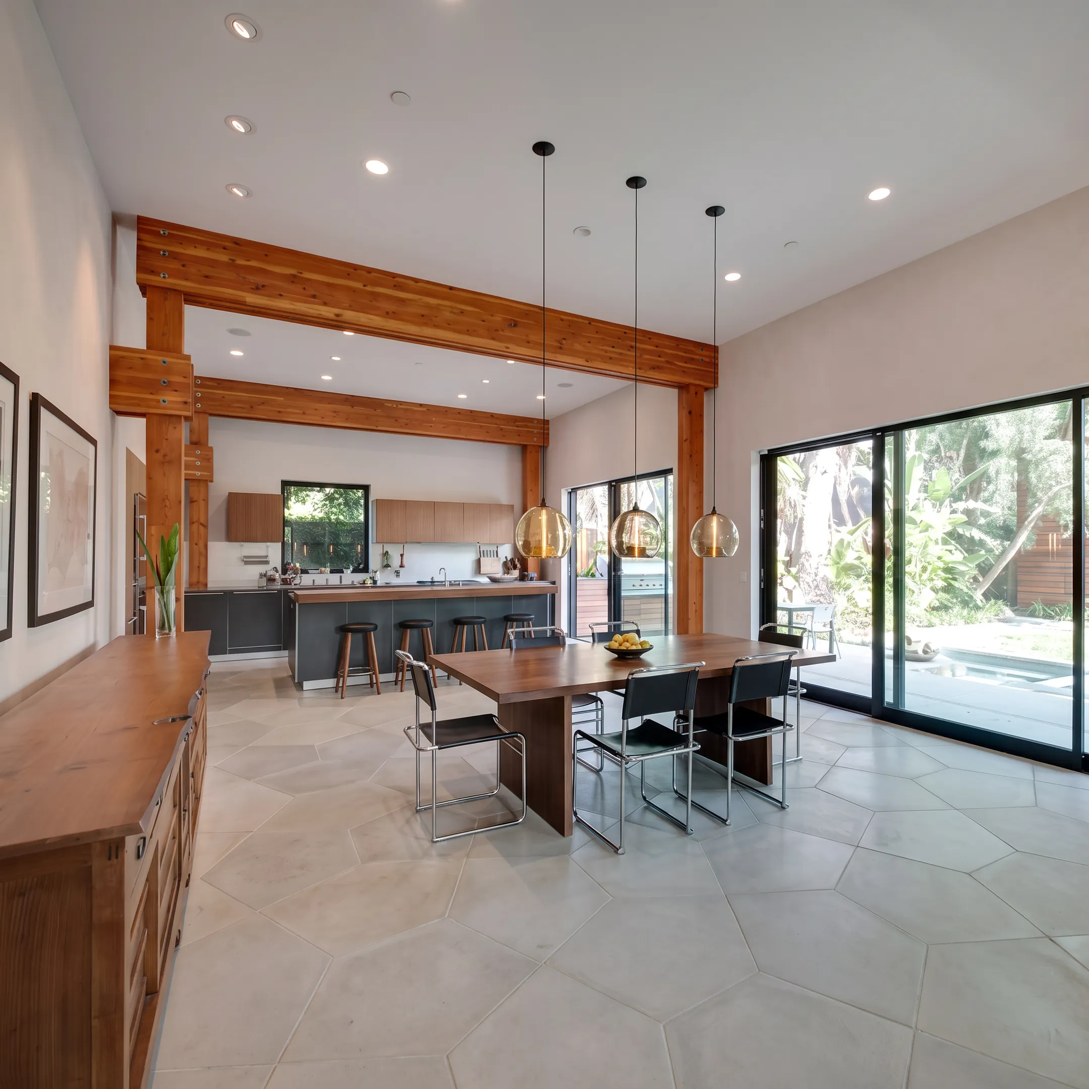Architect reviewing whole home remodel plans with homeowners at a design table