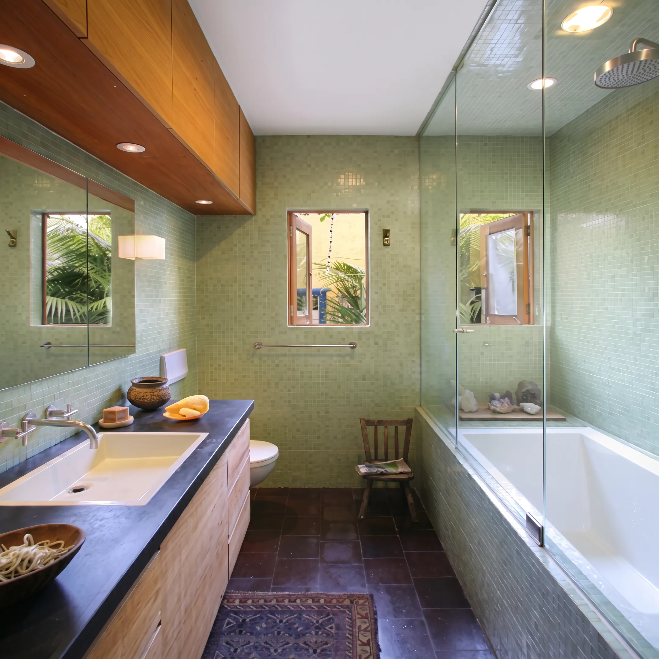 Bathroom remodeling materials and architectural drawings on a table
