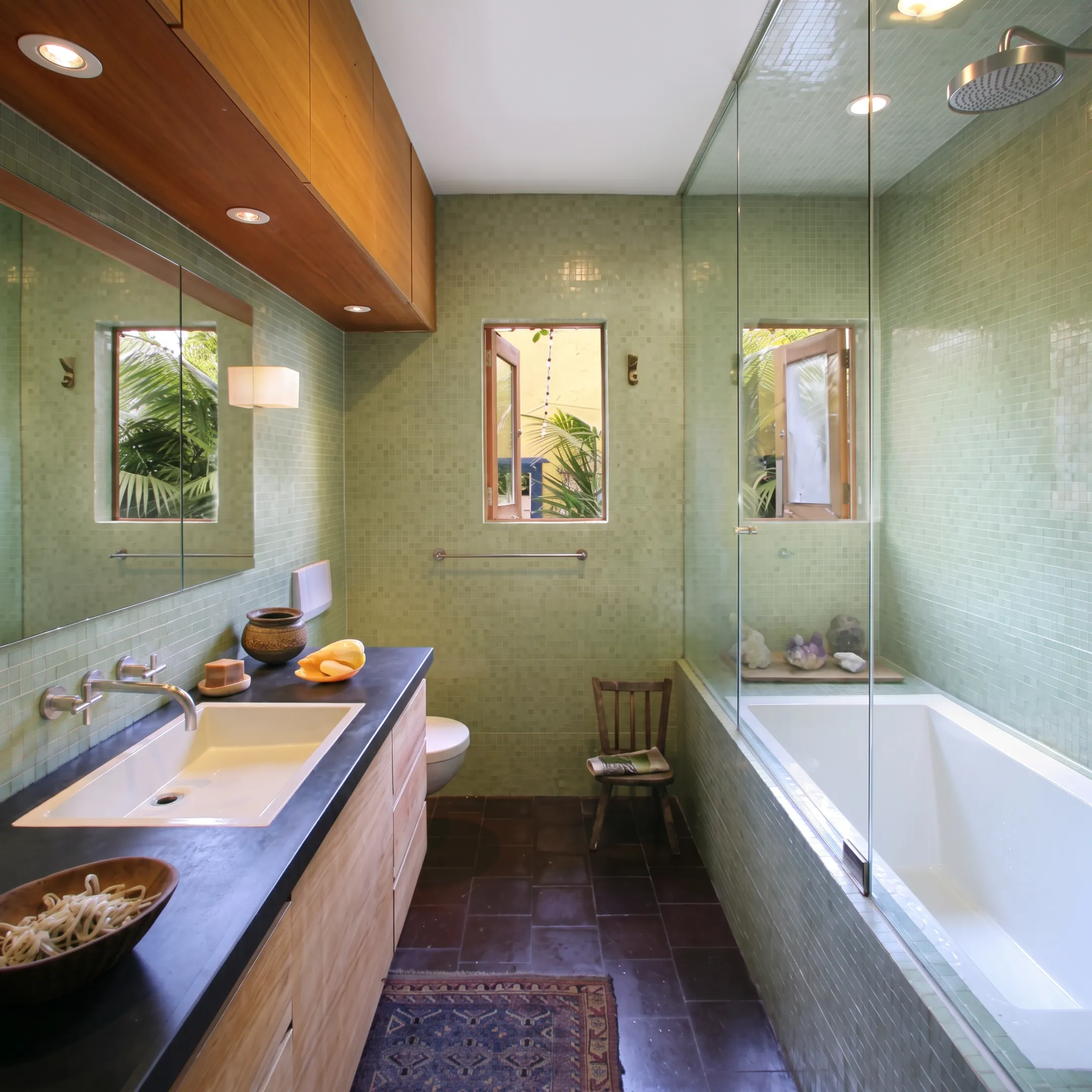 Architect-designed modern bathroom with custom cabinetry and refined natural finishes