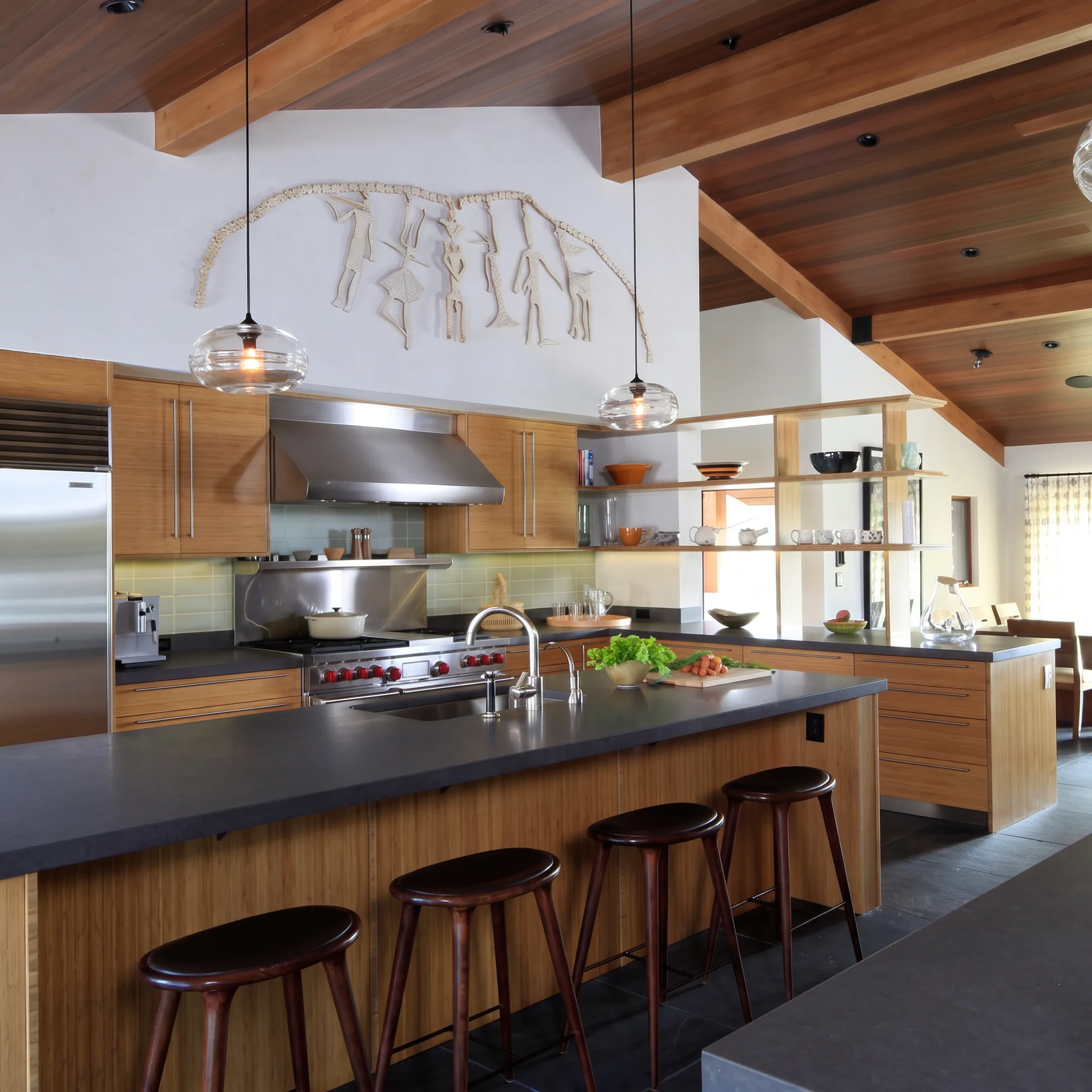 Custom kitchen with refined cabinetry and natural materials