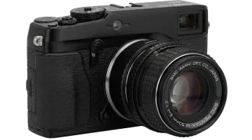 Pentax K-mount lens adapter mounted on Fujifilm X-mount mirrorless camera body