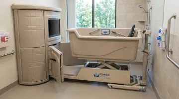 Penner Bathing healthcare bathing system with height-adjustable design for long-term care