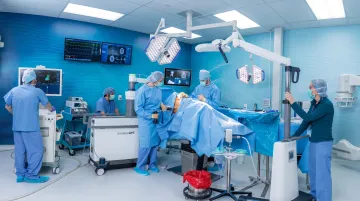Hospital operating room surgical team using robotic surgical navigation system