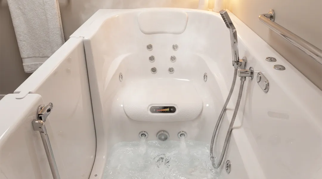 Walk-in bath interior showing jet system heated seat and handheld shower wand