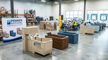 Medical equipment manufacturing facility showroom with bathing systems for long-term care