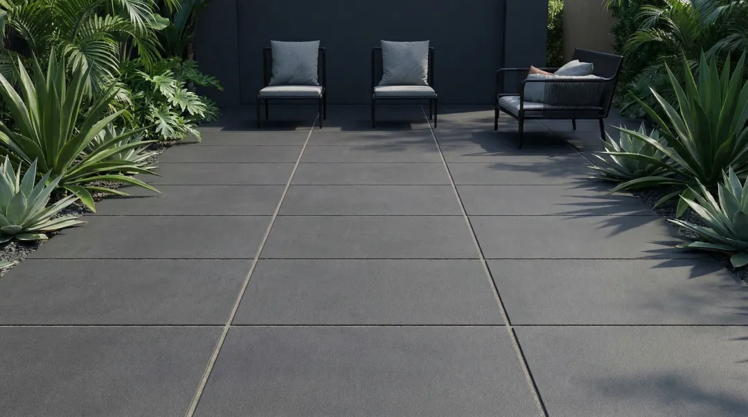 Modern large-format concrete paver patio with geometric layout and neutral tones