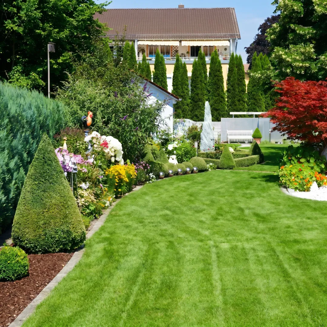 Maintained lawn and landscaped beds at a business property