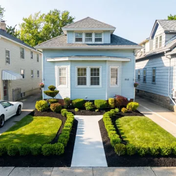 Well-maintained residential front yard with fresh landscaping