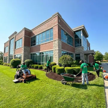 Commercial landscaping crew maintaining a Buffalo business property