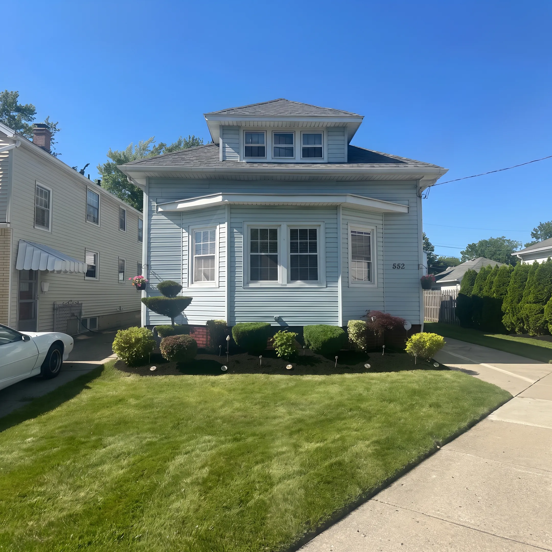 Freshly mowed lawn with clean edging and debris-free walkways