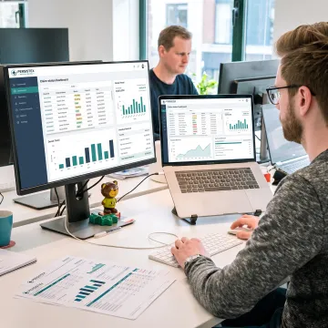Billing team reviewing physician revenue data