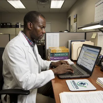 Specialist reviewing pediatric CPT codes