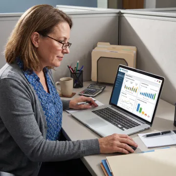 Specialist reviewing medical practice financial dashboard
