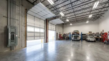 Personal Warehouse unit interior showing high ceilings electrical service and overhead doors