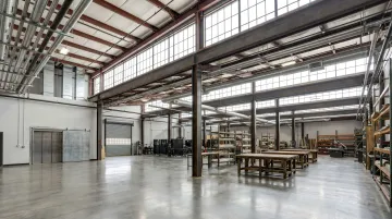 Industrial creative campus with high ceilings freight elevators and maker studio spaces
