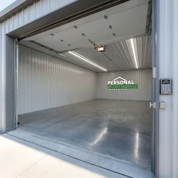 Interior RV and boat storage unit with overhead door