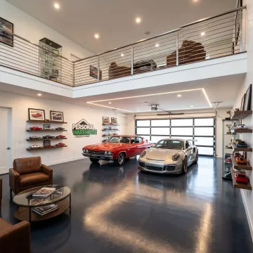 Custom collector garage with mezzanine and lighting