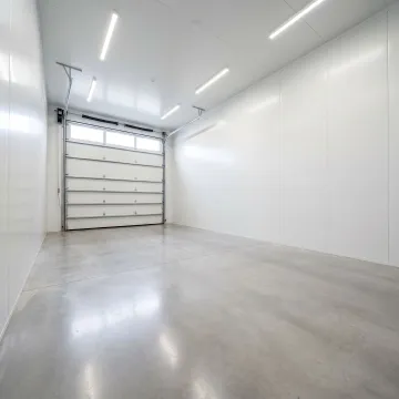 Interior RV storage unit with overhead door