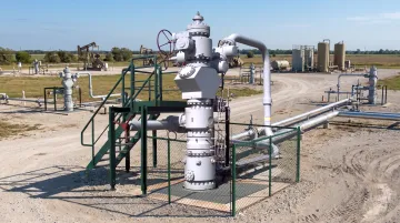 Natural gas drilling site with active wells in rural Texas basin