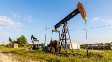 Oil and gas drilling site with active wells in rural Texas basin