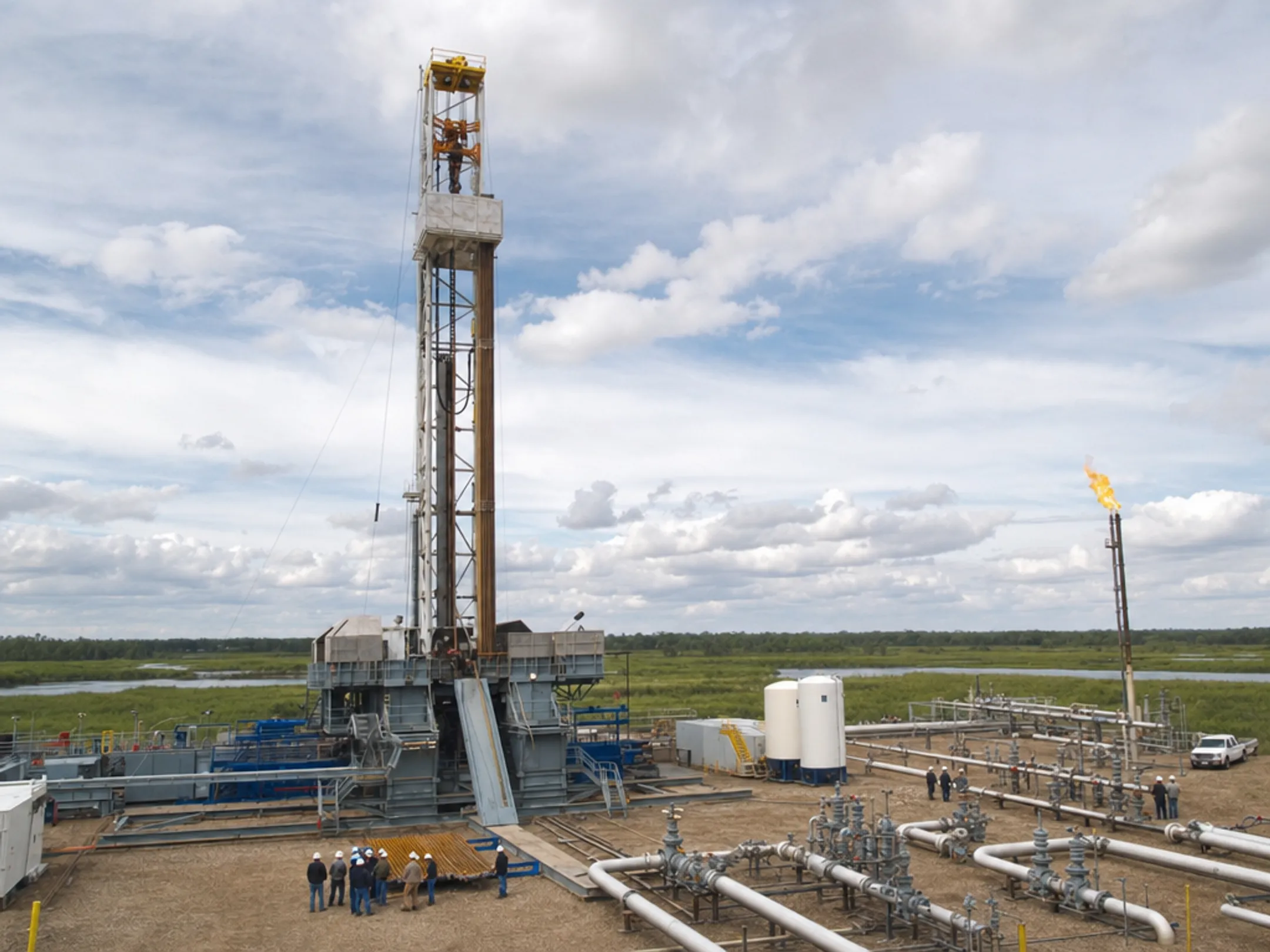 Natural gas drilling site with production equipment and pipelines