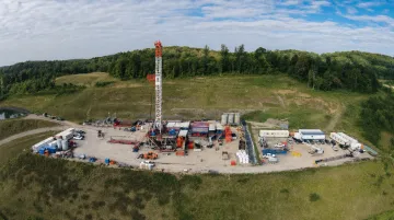 Natural gas drilling rig operating at oil and gas development site