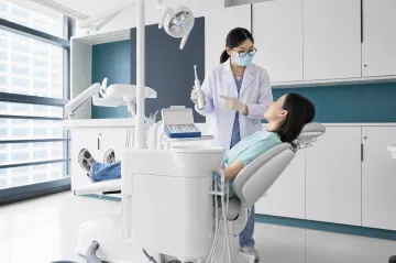 Dentist recommending oral care products to patient in clinic setting