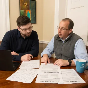 Advisor explaining workplace coverage to a small business owner