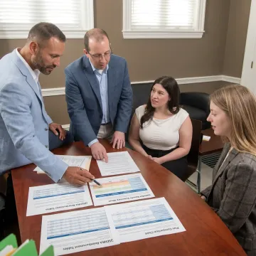 Advisor explaining QSEHRA benefits to a small business owner