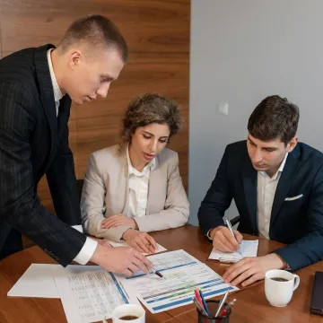 Advisor explaining health plan options to business owner