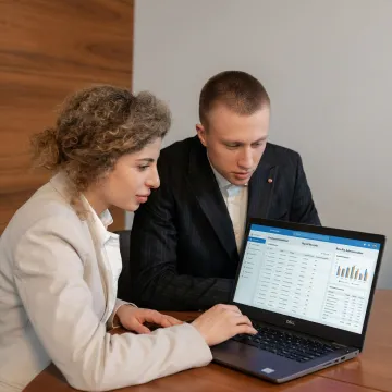 HR professional assisting a business owner with employee administration