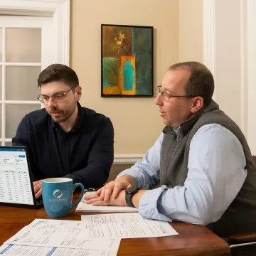 Payroll specialist assisting a small business owner