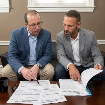 Benefits advisor reviewing group health plan options