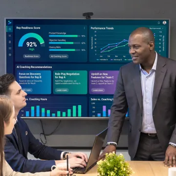 Sales manager reviewing coaching analytics