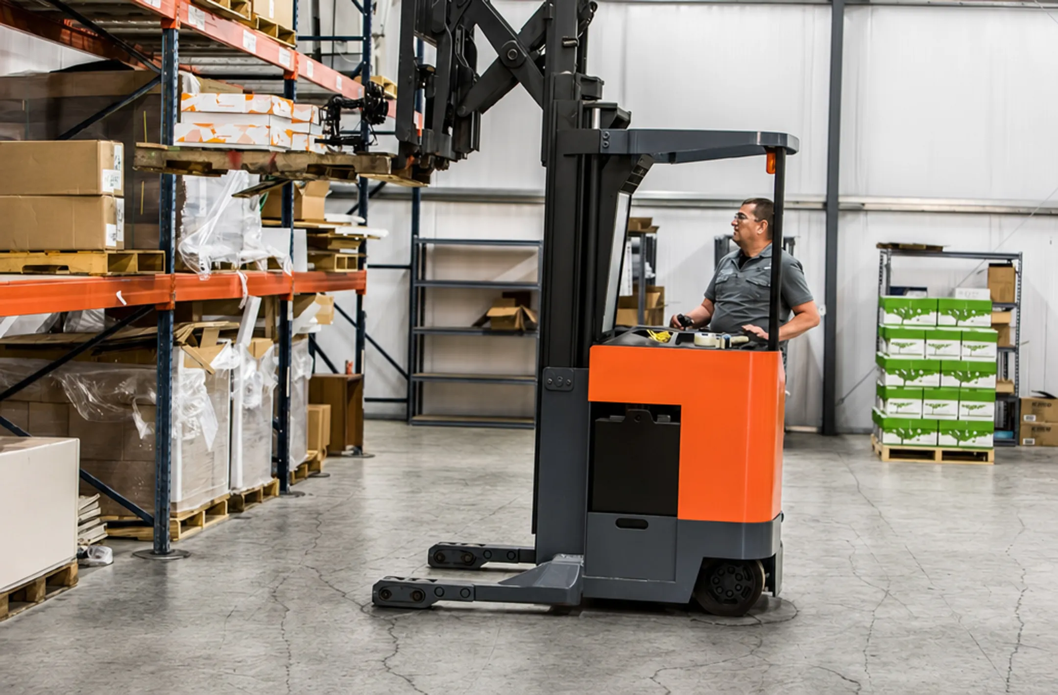 Industrial warehouse floor with forklift traffic and steel racking