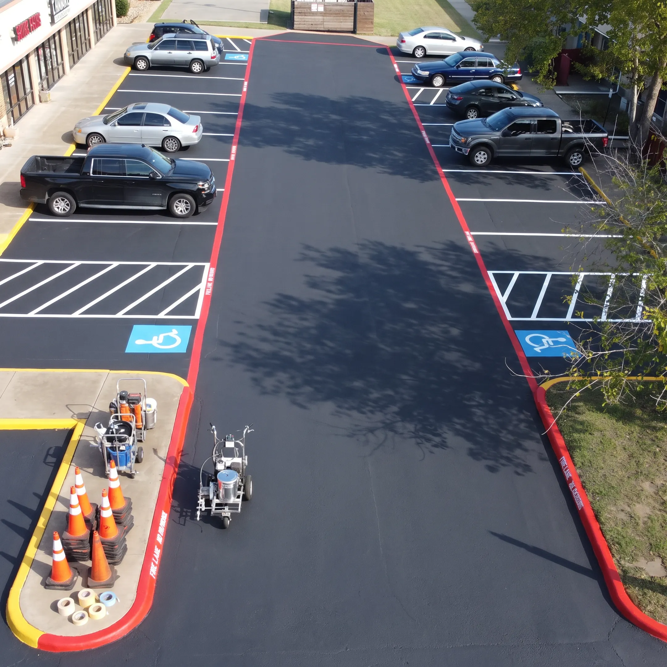 Freshly maintained commercial parking lot with clear striping