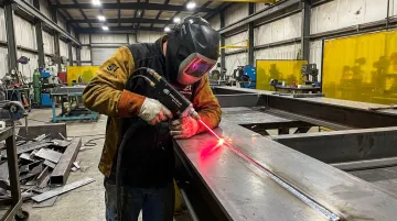 Piranha MA1 Series handheld laser welder in use on mild steel