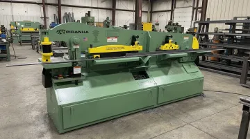 Piranha multi-station ironworker combining punching shearing coping and notching stations