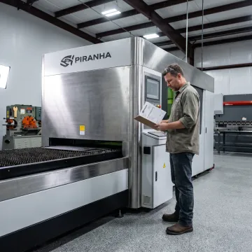 Fabrication professional reviewing a CNC machine investment