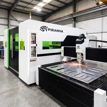 CNC fiber laser cutting a steel sheet