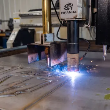 CNC plasma cutter cutting steel plate