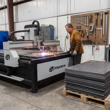 Metal fabrication operator using industrial cutting equipment