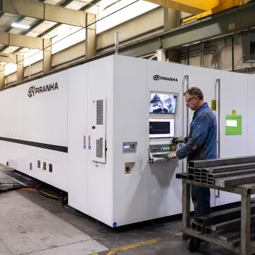 Fabrication technician operating precision metal cutting equipment